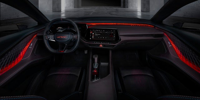 The interior features a center screen canted toward the driver.
