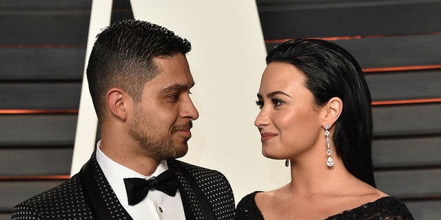 Actor Wilmer Valderrama and singer Demi Lovato arrive at the 2016 Vanity Fair Oscar Party Hosted By Graydon Carter at Wallis Annenberg Center for the Performing Arts on February 28, 2016, in Beverly Hills, California.  