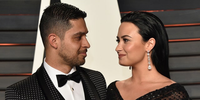 Actor Wilmer Valderrama and singer Demi Lovato arrive at the 2016 Vanity Fair Oscar Party Hosted By Graydon Carter at Wallis Annenberg Center for the Performing Arts on February 28, 2016, in Beverly Hills, California.  