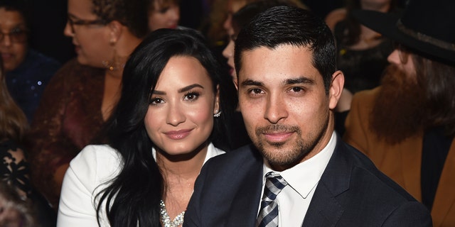 Singer Demi Lovato, left, and actor Wilmer Valderrama attend The 58th GRAMMY Awards at Staples Center on February 15, 2016 in Los Angeles, California.  
