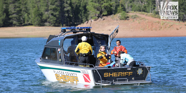 Prosser Creek Reservoir water team of the Pacer County Sherriff's department search for Kiely Rodni or evidence of her whereabouts 