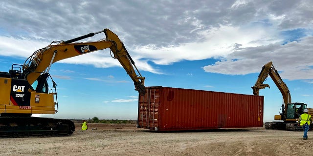 Construction begins to fill gaps in the border wall in Yuma, Arizona, on Friday, Aug. 12, 2022.