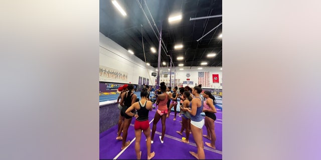 The Fisk University gymnastics team huddles up on their first day of practice, on August 8, 2022.