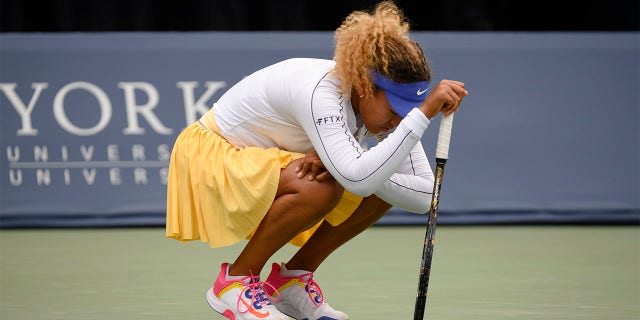 Naomi Osaka rests during her match against Kaia Kanepi of Estonia during the National Bank Open tennis tournament, Tuesday, Aug. 9, 2022, in Toronto.