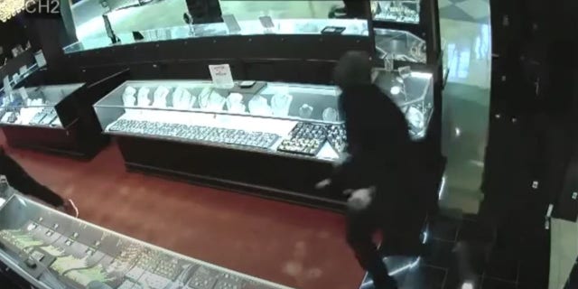 Three masked men smashed glass display cases holding high-end watches at the Diamond Galleria store at the Citrus rk Town Center mall in Florida, making off with more than $100,000 in merchandise, authorities said.