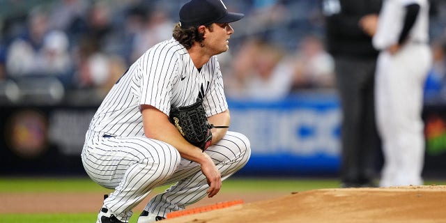 Gerrit Cole #45 of the New York Yankees reacts after allowing a home run to Vladimir Guerrero Jr. #27 of the Toronto Blue Jays in the first inning during the game between the Toronto Blue Jays and the New York Yankees at Yankee Stadium on Wednesday, April 13, 2022 in New York, New York.