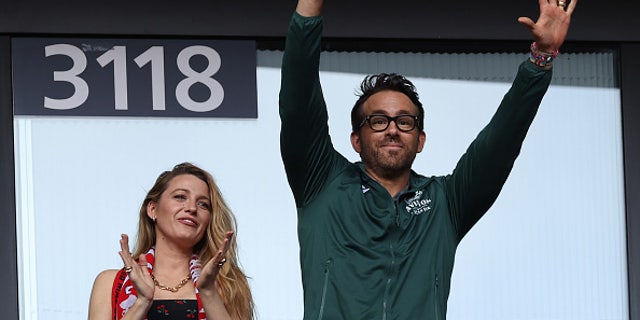 Wrexham owner Ryan Reynolds and his wife Blake Lively attend a soccer match in London in May.