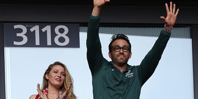Wrexham owner Ryan Reynolds and his wife Blake Lively attend a soccer match in London in May.