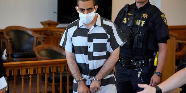 Hadi Matar, 24, center, arrives for an arraignment in the Chautauqua County Courthouse in Mayville, N.Y., on Saturday.