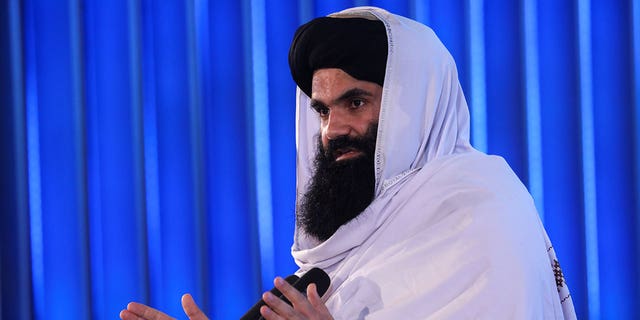 Afghan Taliban's acting Interior Minister Sirajuddin Haqqani speaks during the anniversary of the departure from the Soviet Union, in Kabul, Afghanistan April 28, 2022.