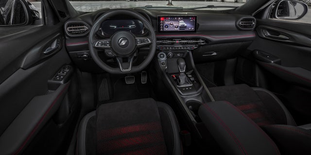 The Hornet's interior comes standard with dual digital displays and a center stack angled toward the driver.