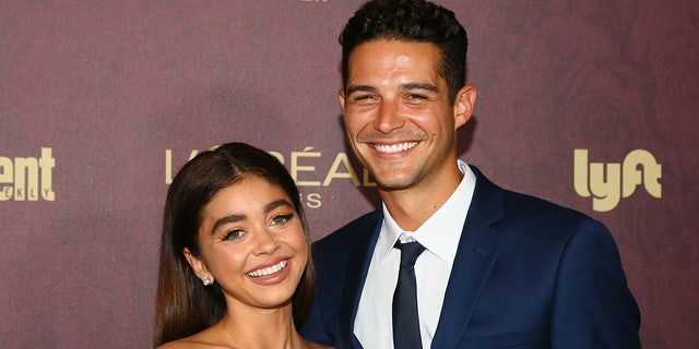 Sarah Hyland marries Wells Adams, seen in 2018, with her "Modern Family" co-stars in attendance at wedding.