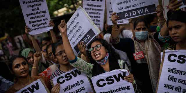 Activists protest the remission of sentences for 11 convicted of gang rapists, in New Delhi, India, on Thursday, Aug. 18, 2022.