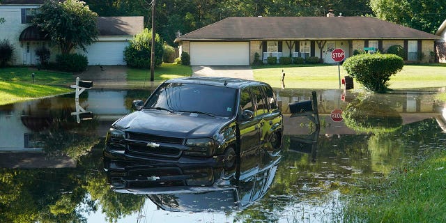 Officials on Monday said that roads around Jackson were still flooded and urged residents not to return home until local officials say it is safe to do so.