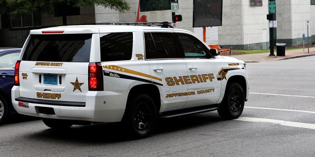 BIRMINGHAM, AL - JULY 04: A Jefferson County Sheriff vehicle drives past the Jefferson County Courthouse in Birmingham, Alabama on July 4, 2018.