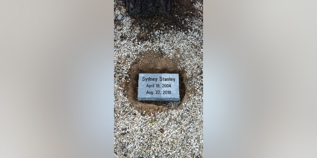 Seen in this image is a plaque dedicated to Sydney Stanley, who died in a hot car accident at the age of 6.