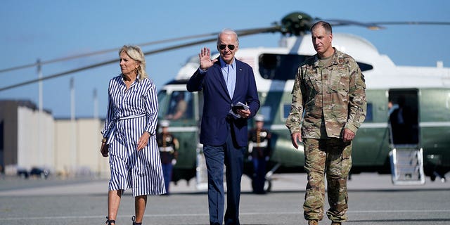 President Joe Biden and first lady Jill Biden, walk to board Air Force One for a trip to Kentucky to view flood damage, Monday, Aug. 8, 2022, in Dover Air Force Base, Del. 