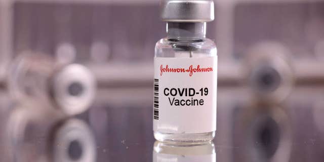 Drawing syringe one dose of Johnson &;  Johnson vaccine seen in this illustration taken on January 16, 2022.