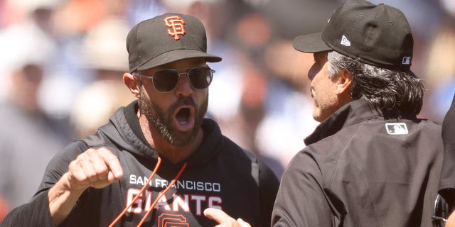 San Francisco Giants manager Gabe Kapler argues with umpire Phil Cuzzi in the sixth inning of a game against the Los Angeles Dodgers at Oracle Park Aug. 4, 2022, in San Francisco.