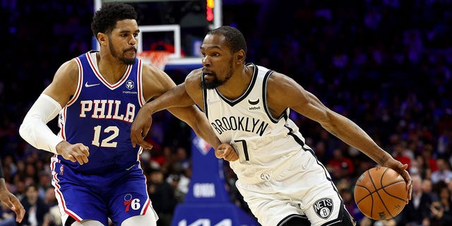 Kevin Durant #7 of the Brooklyn Nets heads for the net as Tobias Harris #12 of the Philadelphia 76ers defends in the second half at Wells Fargo Center on March 10, 2022 in Philadelphia, Pennsylvania. The Brooklyn Nets defeated the Philadelphia 76ers 129-100.
