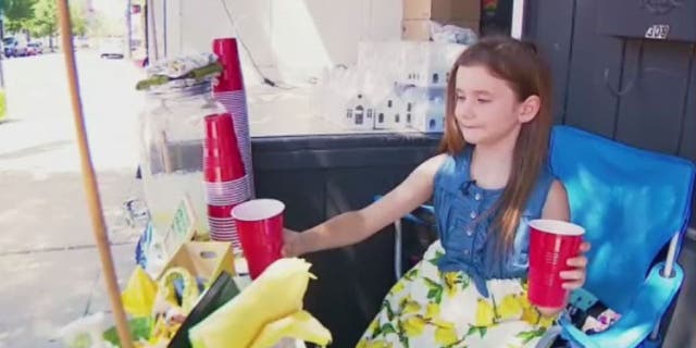 Asa Baker, 8, had to close her lemonade stand after complaints from a local festival