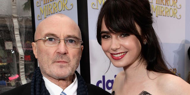Musician Phil Collins (L) and actress Lily Collins arrive at Relativity Media's "Mirror Mirror" Los Angeles premiere at Grauman's Chinese Theatre on March 17, 2012, in Hollywood, California.  (Photo by Todd Williamson/Getty Images For Relativity Media)