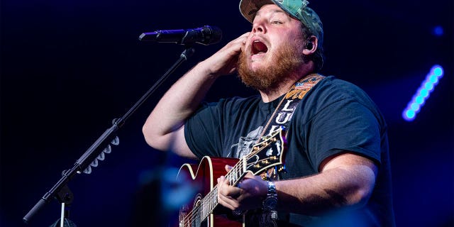 Luke Combs performing on tour
