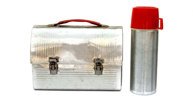 Seen in this photo is a vintage metal lunch box and Thermos.