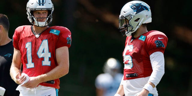 Sam Darnold, 14, and Baker Mayfield, 6, of the Carolina Panthers during training camp at Wofford College in Spartanburg, SC on August 2, 2022.