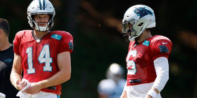 Sam Darnold, 14, and Baker Mayfield, 6, of the Carolina Panthers during training camp at Wofford College in Spartanburg, SC on August 2, 2022.