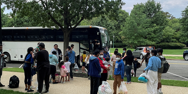 FILE PHOTO: Approximately 30 migrants disembark after arriving on a bus from Texas, at Union Station near the U.S. Capitol in Washington, U.S., July 29, 2022. REUTERS/Ted Hesson/File Photo 
