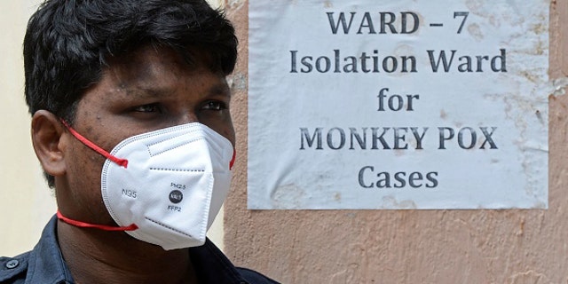 A security guard stands outside a monkey pox quarantine ward at a government hospital in Hyderabad on July 25, 2022.