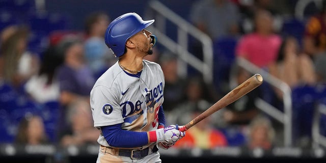 Mookie Betts #50 of the Los Angeles Dodgers hits a home run in the ninth inning against the Miami Marlins at loanDepot park on Aug. 26, 2022, in Miami.