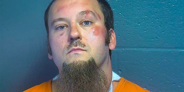 FILE: This image provided by the Oklahoma County Jail shows Benjamin Plank. An Oklahoma deputy sheriff remained hospitalized in stable condition Tuesday, Aug. 23, 2022 following a shooting that killed a fellow deputy in southwest Oklahoma City, authorities said.