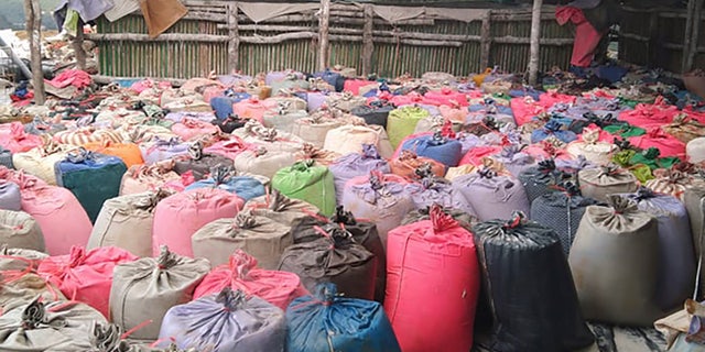 Bags filled with rare earth ores wait for pickup in Kachin, Myanmar, for transport to China in early 2022.