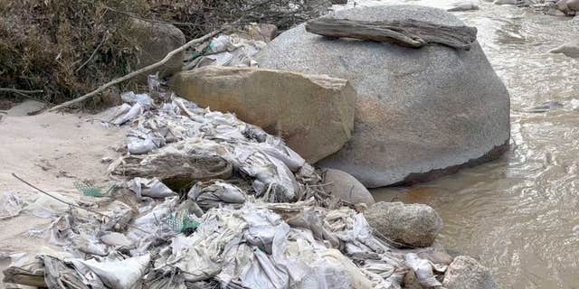 Trash fills a creek in Myanmar's Kachin State in early 2022, a common occurrence in the region.