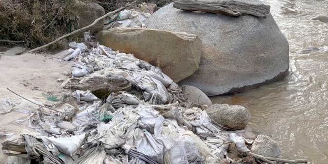 Trash fills a creek in Myanmar's Kachin State in early 2022, a common occurrence in the region.