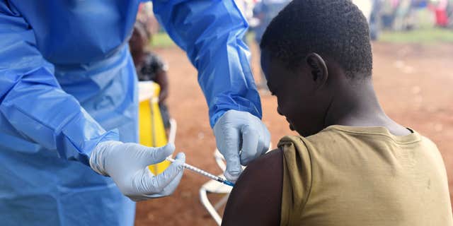 A boy gets vaccinated for Ebola virus in the village of Mangina in North Kivu province of the Democratic Republic of Congo, on Aug. 18, 2018, near where a new case has been linked to the 2018 Ebola virus outbreak.