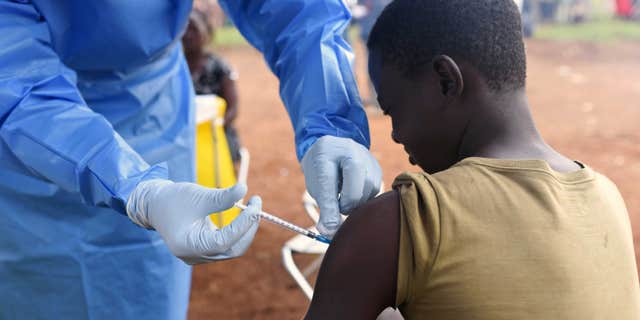 A boy gets vaccinated for Ebola virus in the village of Mangina in North Kivu province of the Democratic Republic of Congo, on Aug. 18, 2018, near where a new case has been linked to the 2018 Ebola virus outbreak.