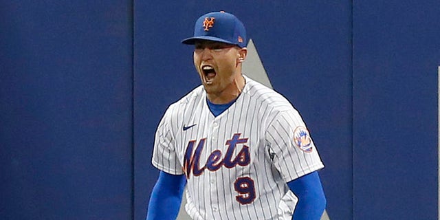 No. 9 Brandon Nimmo of the New York Mets reacts after catching a ball in the seventh inning against the Los Angeles Dodgers at Citi Field on August 31, 2022 in New York City.