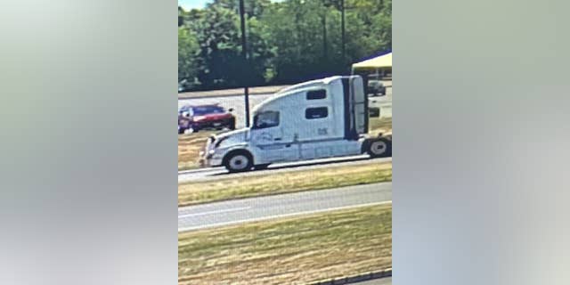 A witness saw a bloodied woman screaming for help inside this white tractor-trailer on Wednesday afternoon, police said. 