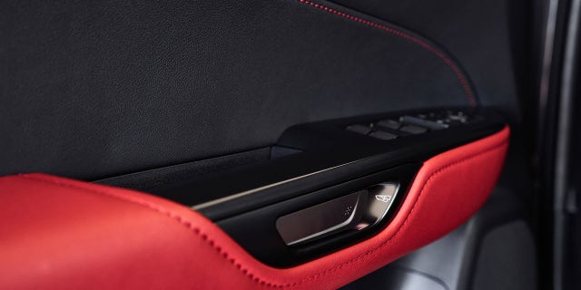 The door is released by using an electronic thumb-controlled button.