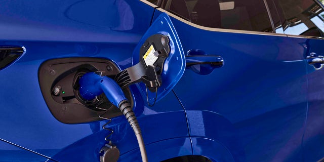 The NX450h+ has an all-electric driving range of 37 miles per charge.