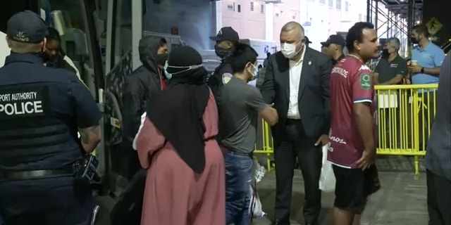 NYC officials welcome migrants arriving by bus from Texas to Port Authority on Aug. 15, 2022.