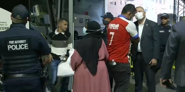 NYC Commissioner of Immigrant Affairs, Manuel Castro, shakes hands with migrants arriving by bus from Texas to Port Authority on Aug. 15, 2022.