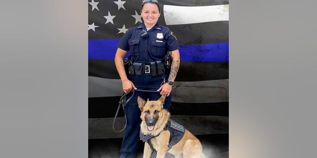 Burton, pictured with her K-9 partner Brev, was in very critical condition after a suspect shot her during a traffic stop Wednesday evening, police said.