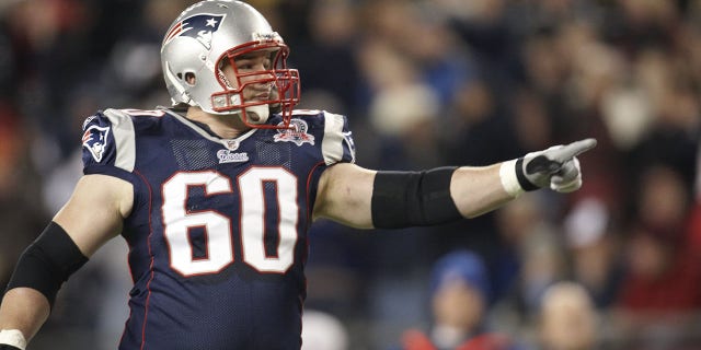 New England Patriots offensive lineman Rich Ohrnberger points during an NFL game against the New York Jets in Foxboro, Massachusetts, on Nov. 22, 2009.