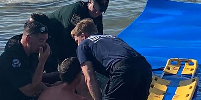 Okaloosa County deputies and Fort Walton police rescued a woman who suffered paralysis to her lower body after jumping from a pontoon boat anchored in shallow water on Sunday.