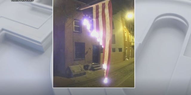 Flag was hanging outside a home on the 200 block of Fulton Street when it was set on fire around 4 a.m. Thursday.