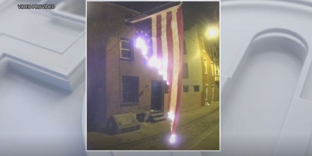 Flag was hanging outside a home on the 200 block of Fulton Street when it was set on fire around 4 a.m. Thursday.